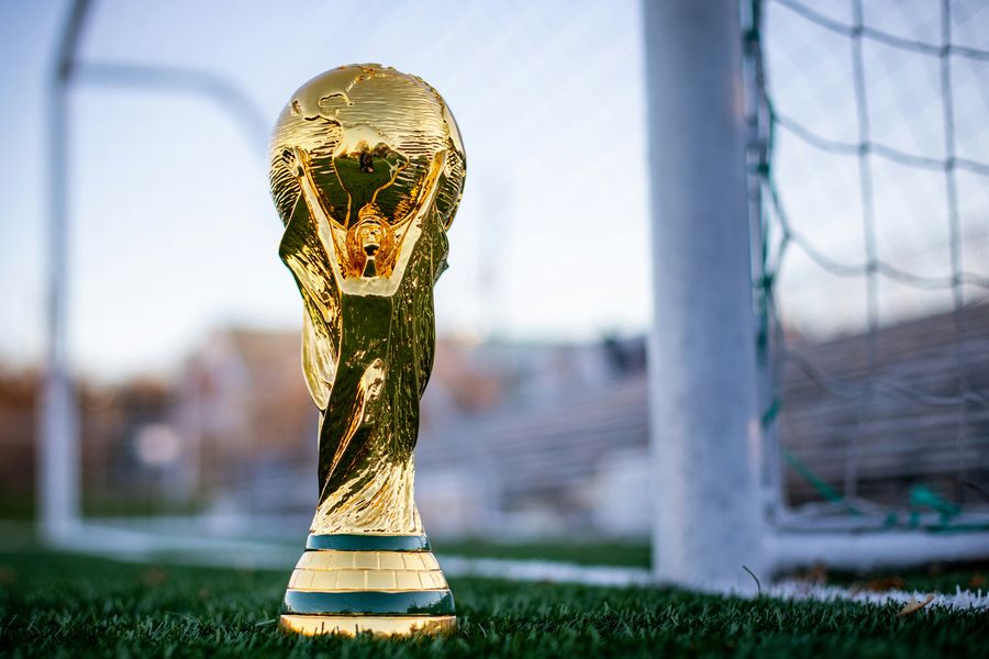 closeup of the World Cup trophy, with 2026 games being hosted in Houston, TX